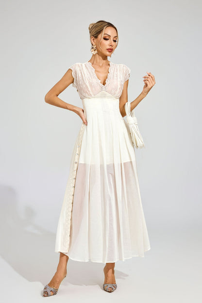 Sukienka midi z haftowanymi gwiazdami 