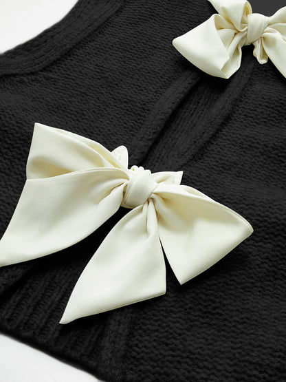 Dzianinowa bluzka z kokardą z przodu