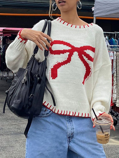 Sweter z kontrastową kokardą