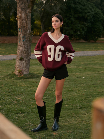 Sweter z kontrastowym wiązaniem i dekoltem w serek