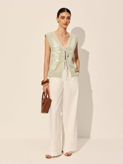 Sweter-kamizelka z haftowaną kokardą i kwiatowym wzorem