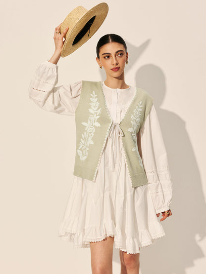 Sweter-kamizelka z haftowaną kokardą i kwiatowym wzorem