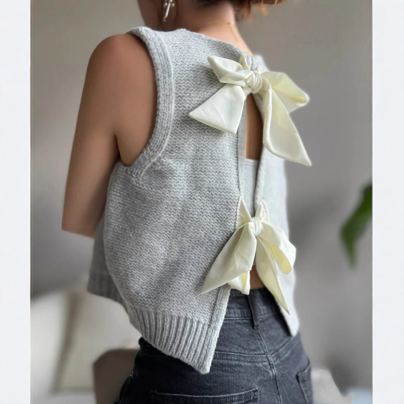 Dzianinowa bluzka z kokardą z przodu